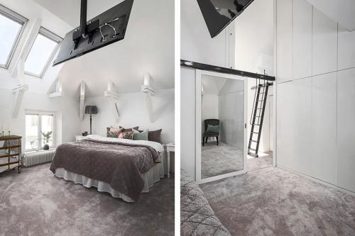 Двухуровневая квартира с черно-белой кухней и чердаком в Швеции 20