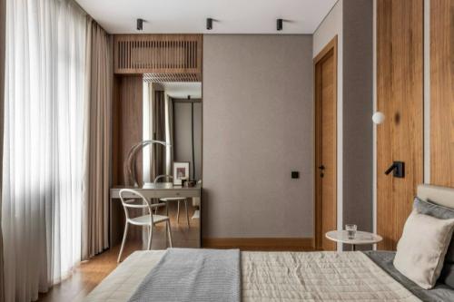 Современный лаконичный интерьер в тёплых оттенках - это пространство, в котором минимализм сочетается с ощущением уюта и спокойствия. 05