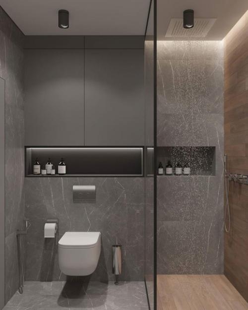 Интерьер санузла. За основу дизайна выбрана серая гамма, которую красиво разбавили современной подсветкой. 01
