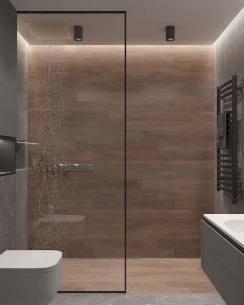 Интерьер санузла. За основу дизайна выбрана серая гамма, которую красиво разбавили современной подсветкой. 03