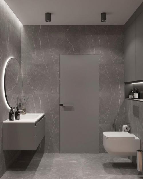 Интерьер санузла. За основу дизайна выбрана серая гамма, которую красиво разбавили современной подсветкой.