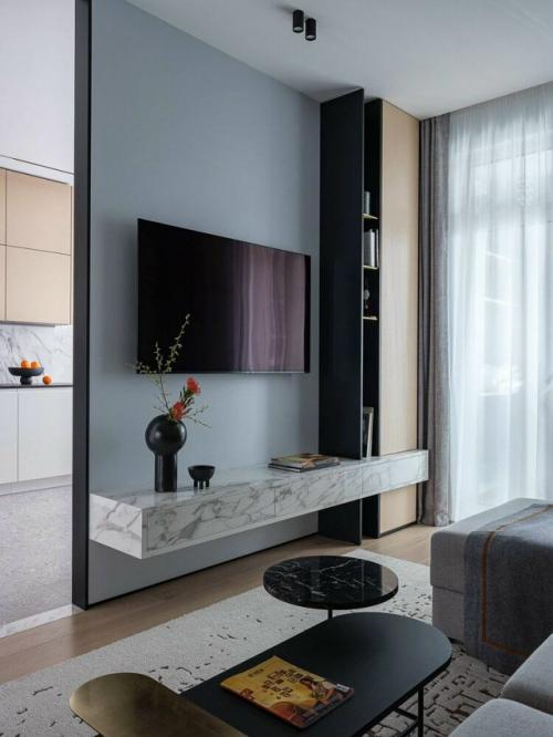 Дизайнеры полностью пересмотрели планировку и создали пространство, где современный стиль гармонично сочетается с функциональностью и комфортом. 07