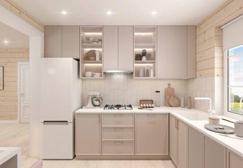 Светлая кухня - гостиная с бежевым кухонным гарнитуром.