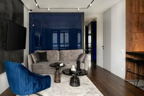 Современная квартира в тёмных тонах выглядит выразительно, стильно и уверенно. 01