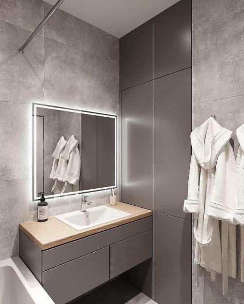 Современная ванная комната, выполненная в спокойной и уютной цветовой гамме, сочетает в себе функциональность и продуманный дизайн. 03