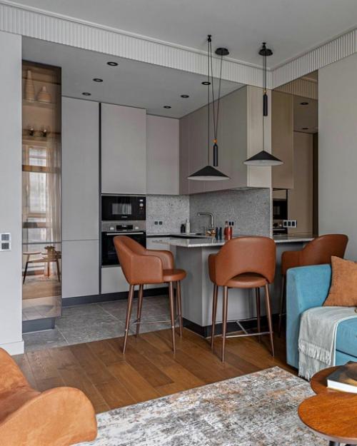 Интерьер в серо - бежевой гамме, с добавлением голубых и сине-зеленых оттенков в качестве акцентов. 03