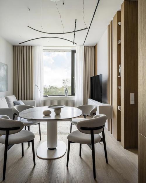 Интерьер этой квартиры - пример того, как минимализм может быть по-настоящему тёплым и уютным. 03