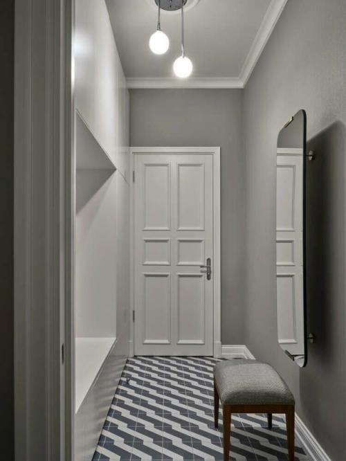 В этой квартире дизайнеру удалось сохранить исторический дух сталинской архитектуры, добавив в него уют и свет. 05