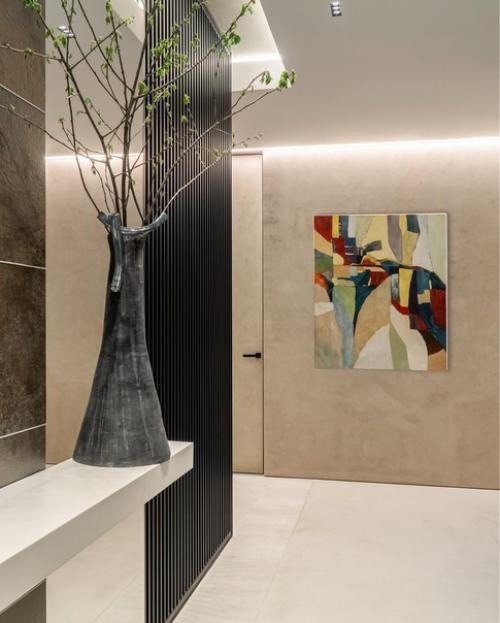 Сдержанная цветовая гамма, минимум мебели и максимум тактильных впечатлений от соприкосновения с натуральным деревом, стеклом, металлом. 08