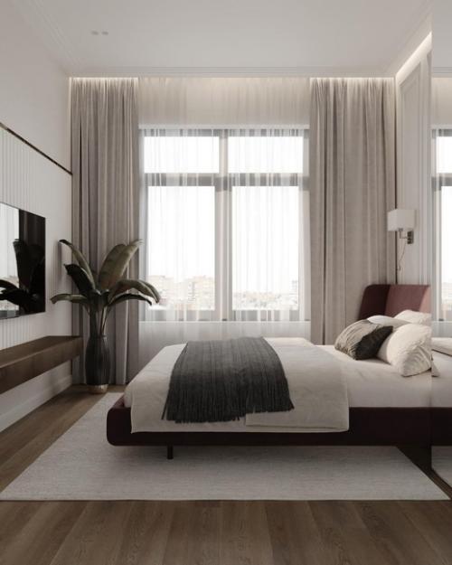 Светлая и просторная и с очень необычным декором на стене спальная комната. 02