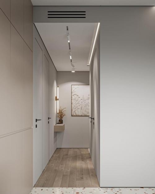 Приятное сочетание цветов без лишних деталей, а также много света, как естественного, так и искусственного, что делает квартиру более просторней. 03