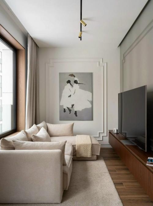 Этот проект - пример того, как дизайнер смог превратить квартиру с неудобной планировкой в комфортное и элегантное пространство для молодой семьи. 06